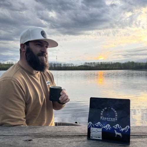Matt with Little Dipper Matt Olsen Drinking Little Dipper coffee by a lake